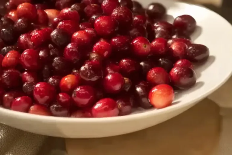 Delicious homemade BEST Cranberry Sauce in a bowl garnished with fresh cranberries.