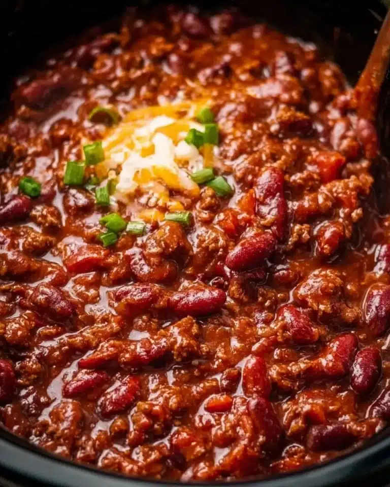 Delicious and hearty Crockpot Chili served in a bowl with toppings.
