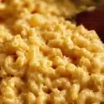 Delicious One Pot Mac & Cheese served in a bowl with cheese melting on top.