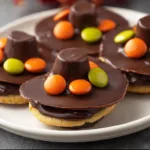 Decorated Pilgrim Hat Cookies for Thanksgiving celebrations.