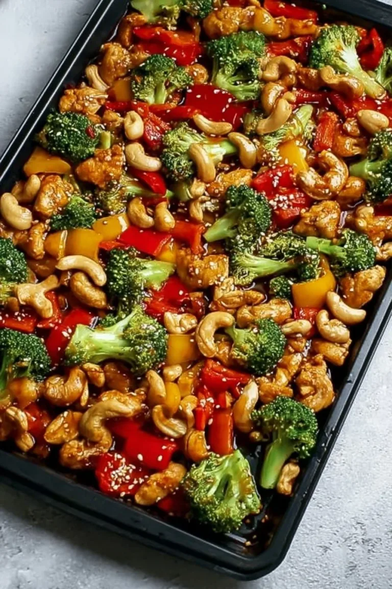 Easy Sheet Pan Cashew Chicken recipe with colorful vegetables and cashews.