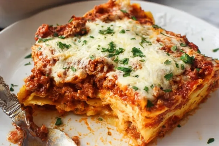 Delicious Lazy Day Lasagna served in a baking dish with cheese and herbs on top.