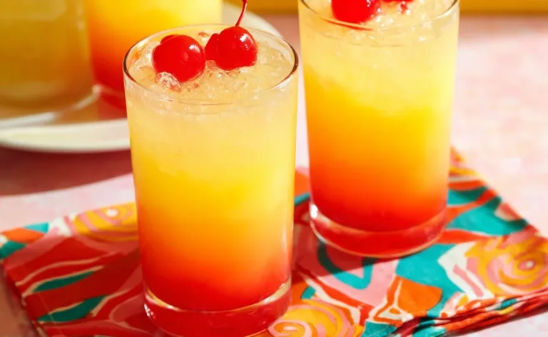 Limoncello Sunrise cocktail garnished with citrus fruits