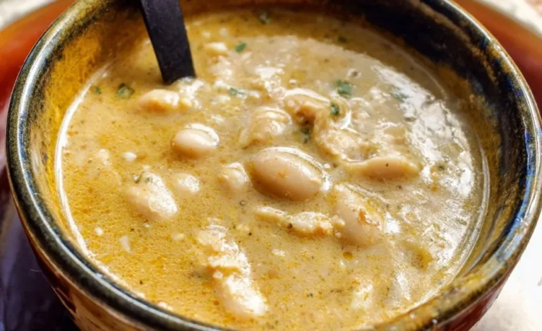 Creamy white chili served in a bowl with toppings
