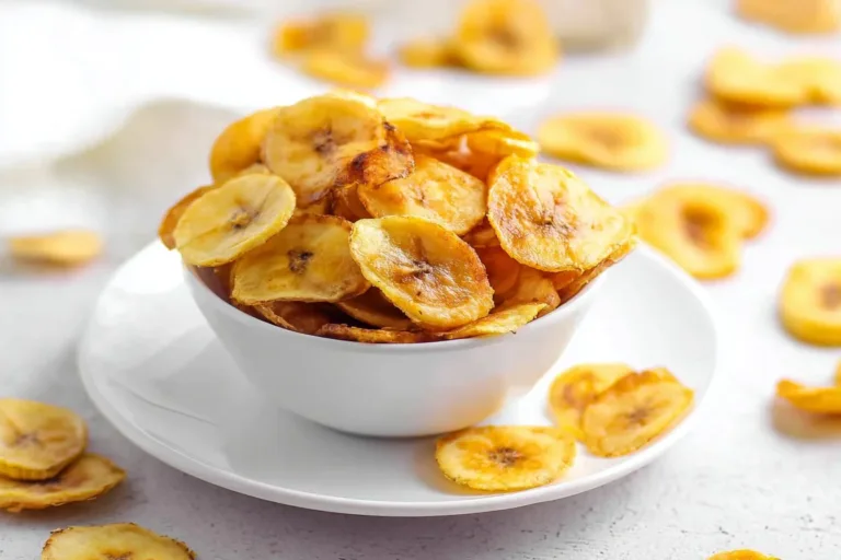 Crispy air fryer banana chips in a bowl, a healthy snack option