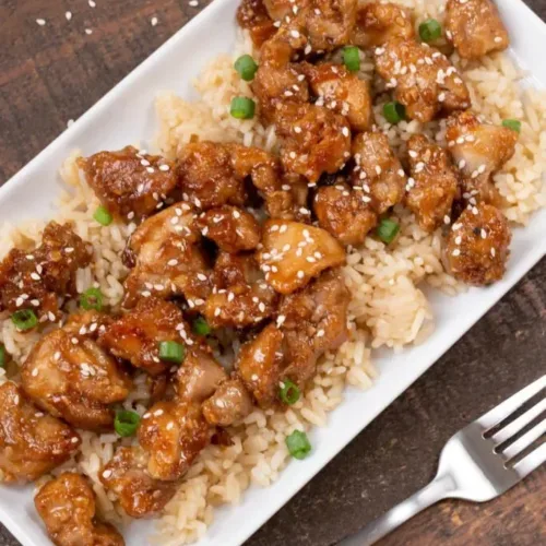 Delicious healthy sesame chicken served with vegetables