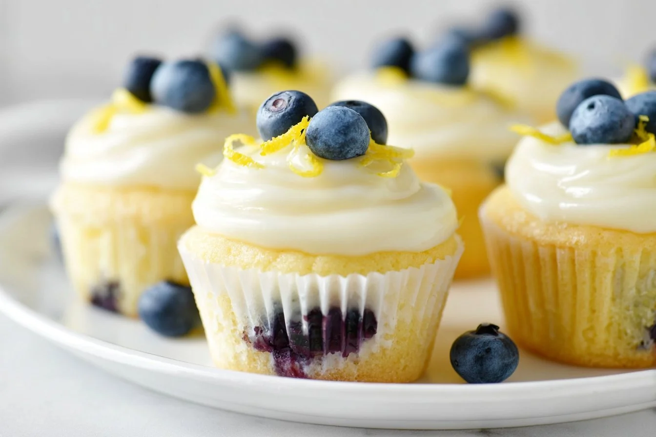 Lemon blueberry cupcakes with lemon cream cheese frosting on a plate