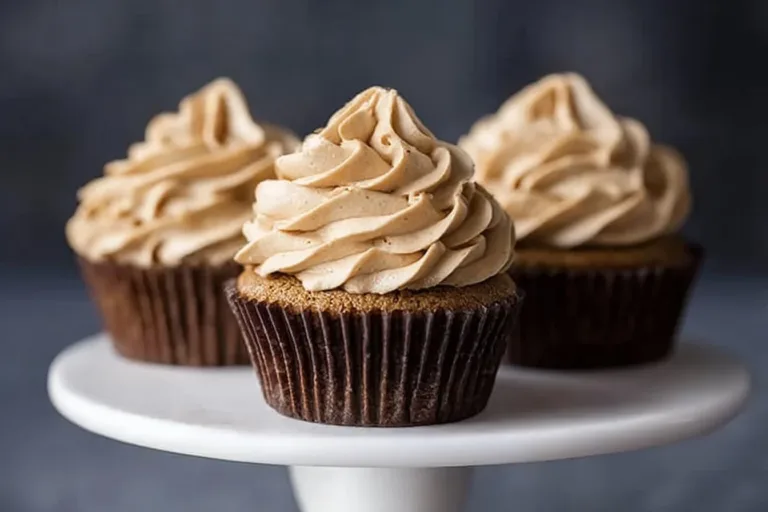 Mocha cupcakes with espresso buttercream frosting on a decorative plate