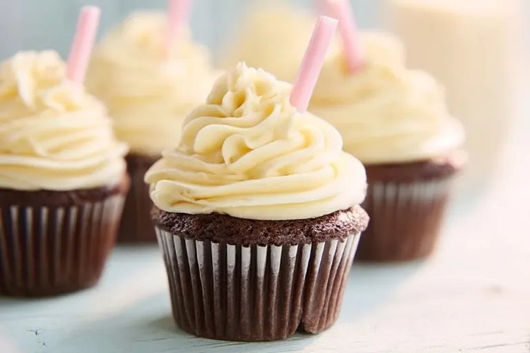 Delicious Root Beer Float Cupcakes topped with creamy frosting