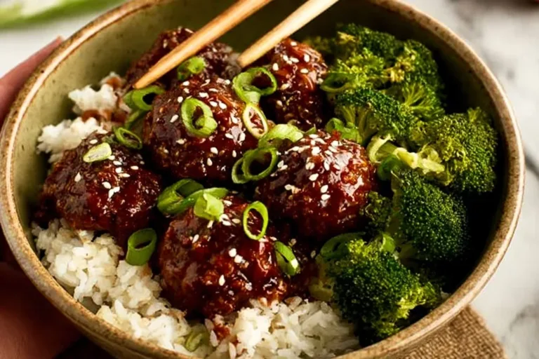 Sticky Mongolian Beef Meatballs served with green onions and sesame seeds.