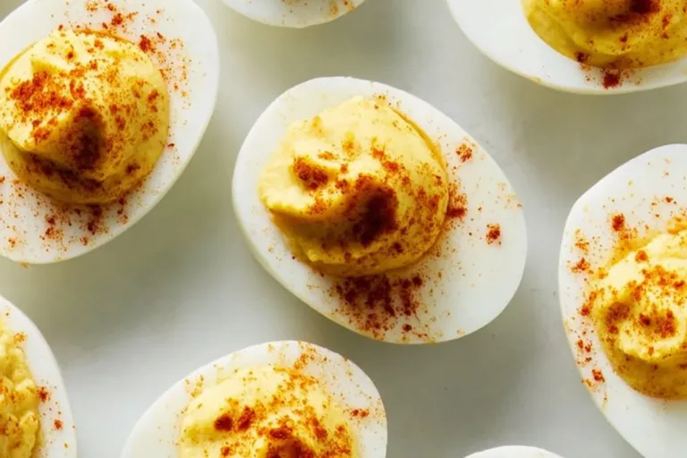 Delicious deviled eggs garnished with paprika and herbs