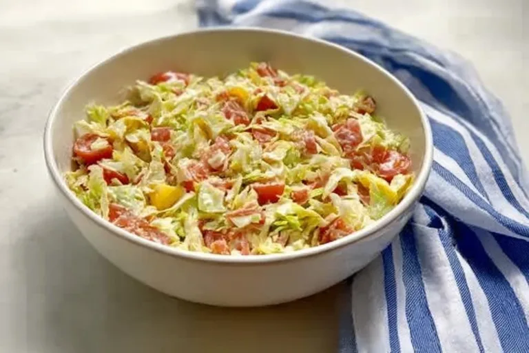 Bowl of vibrant Italian Grinder Salad with chopped vegetables and meats