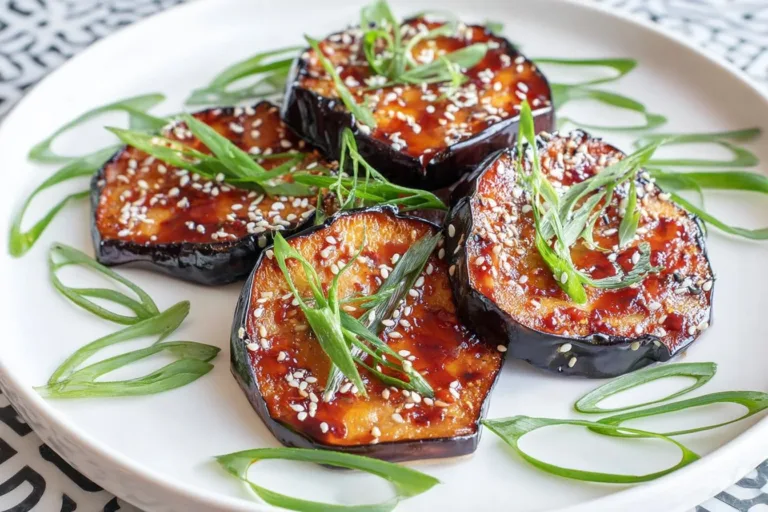 Delicious plate of miso glazed eggplant, showcasing its rich glaze and vibrant colors.