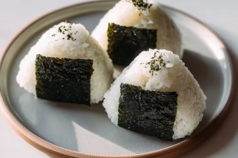 Delicious spicy tuna rice balls garnished with seaweed and sesame seeds