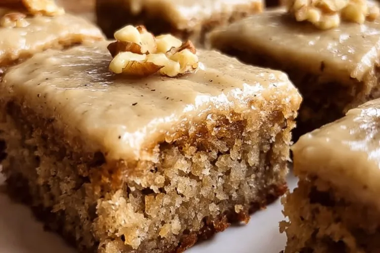 Delicious banana bread brownies with brown butter frosting on a plate