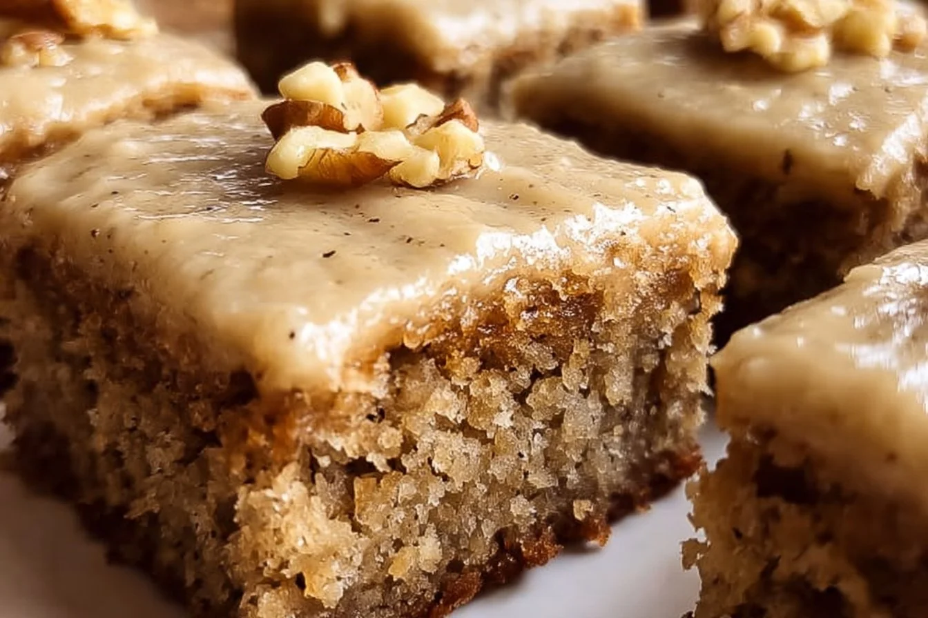 Delicious banana bread brownies with brown butter frosting on a plate