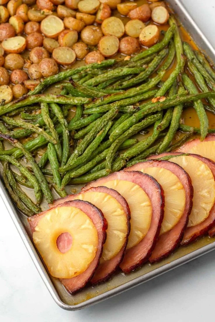 Easy Easter dinner on a sheet pan with delicious dishes and colorful presentation.