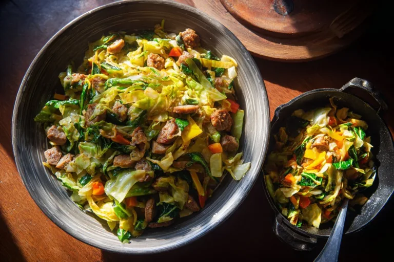 Sausage and Cabbage Stir Fry served in a pan with colorful vegetables