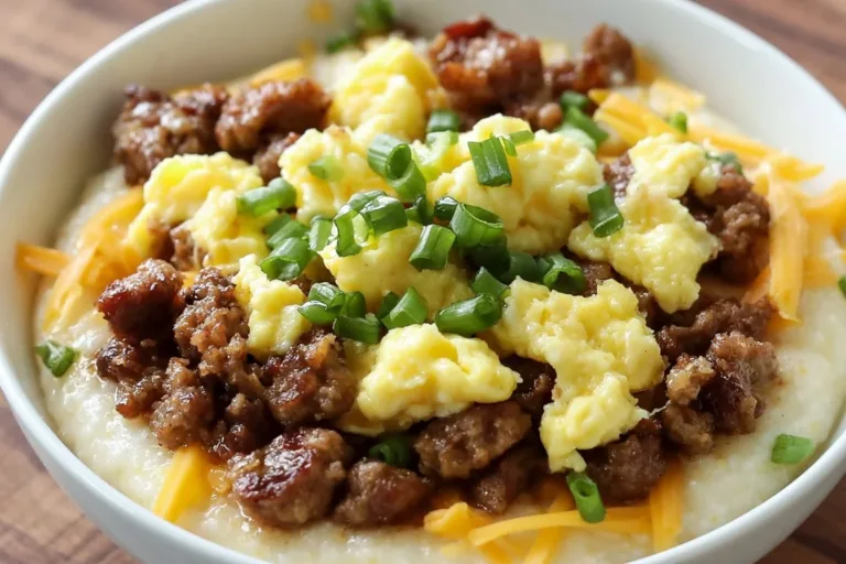Hearty grits breakfast bowl topped with vegetables and protein for a nutritious meal