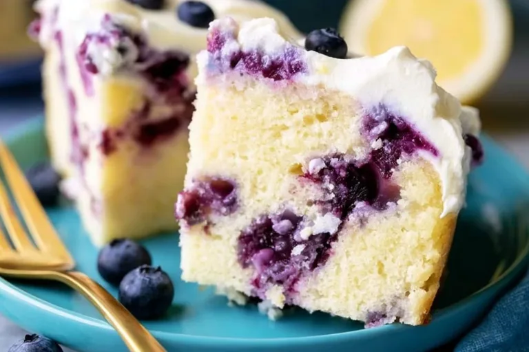 Delicious Lemon Blueberry Cake topped with fresh blueberries and lemon zest