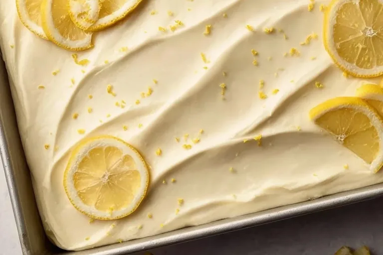 Delicious homemade Lemon Sheet Cake topped with fresh lemon glaze.