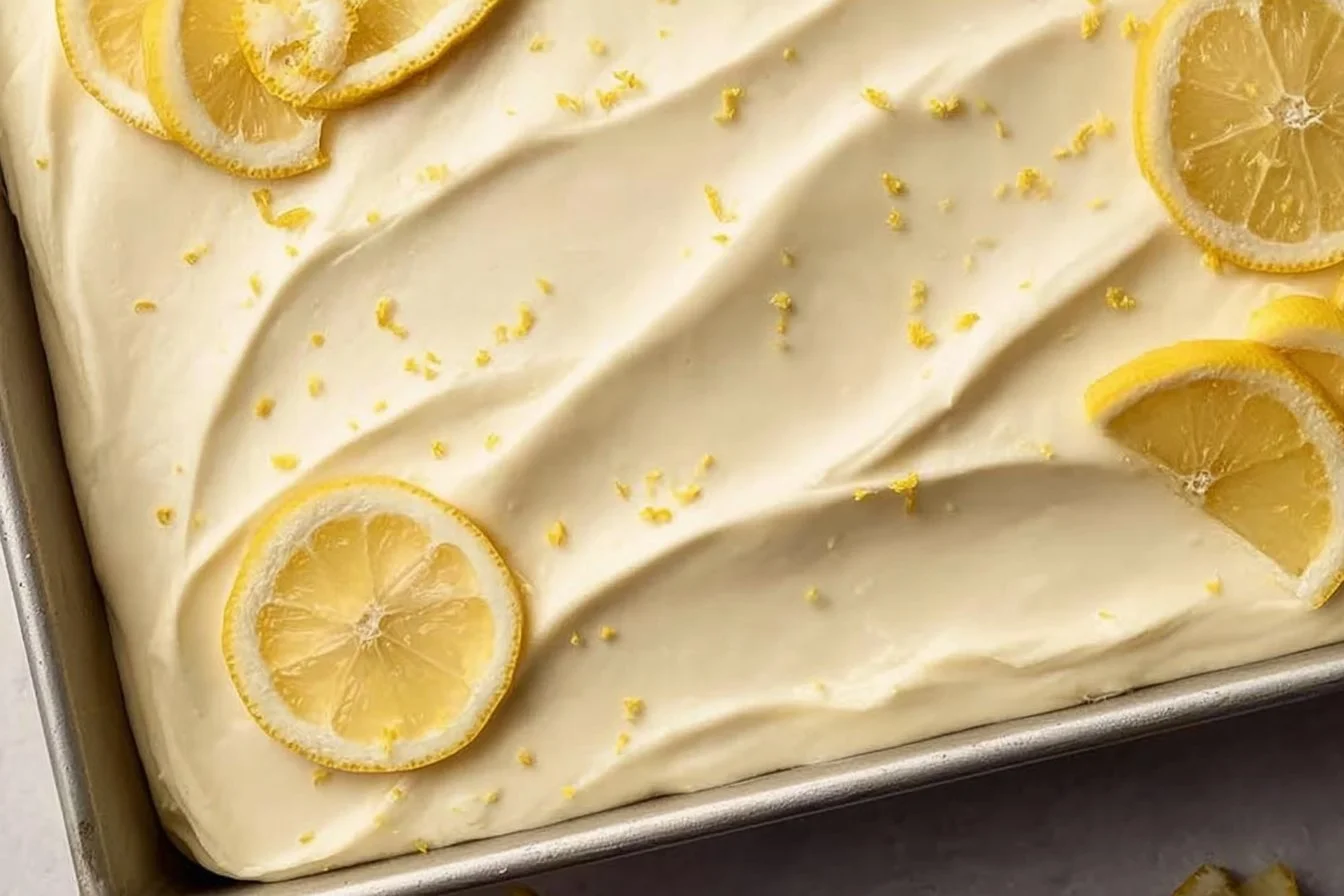 Delicious homemade Lemon Sheet Cake topped with fresh lemon glaze.