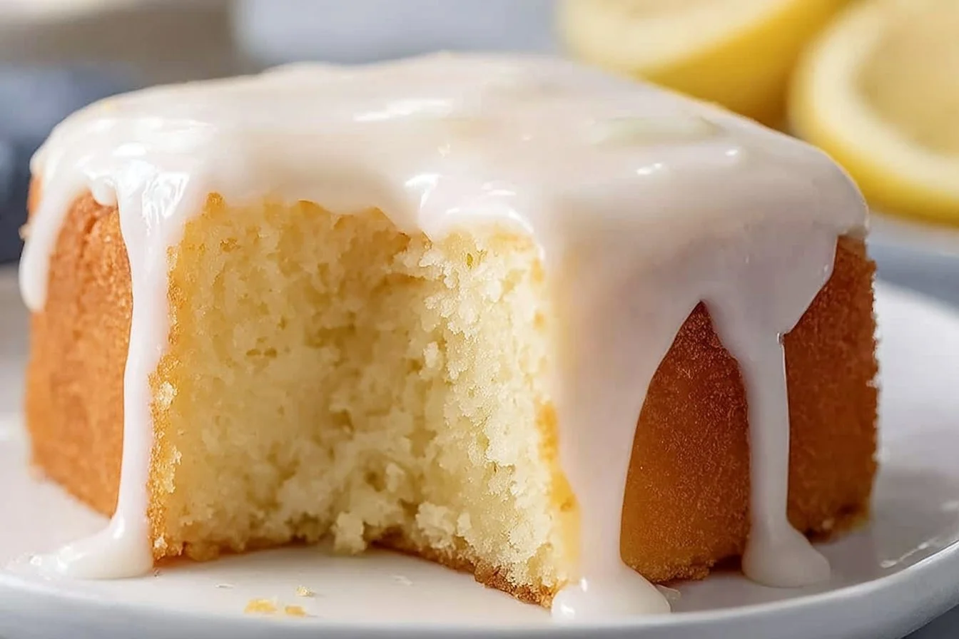Delicious Lemonade Cake served on a plate with lemon slices