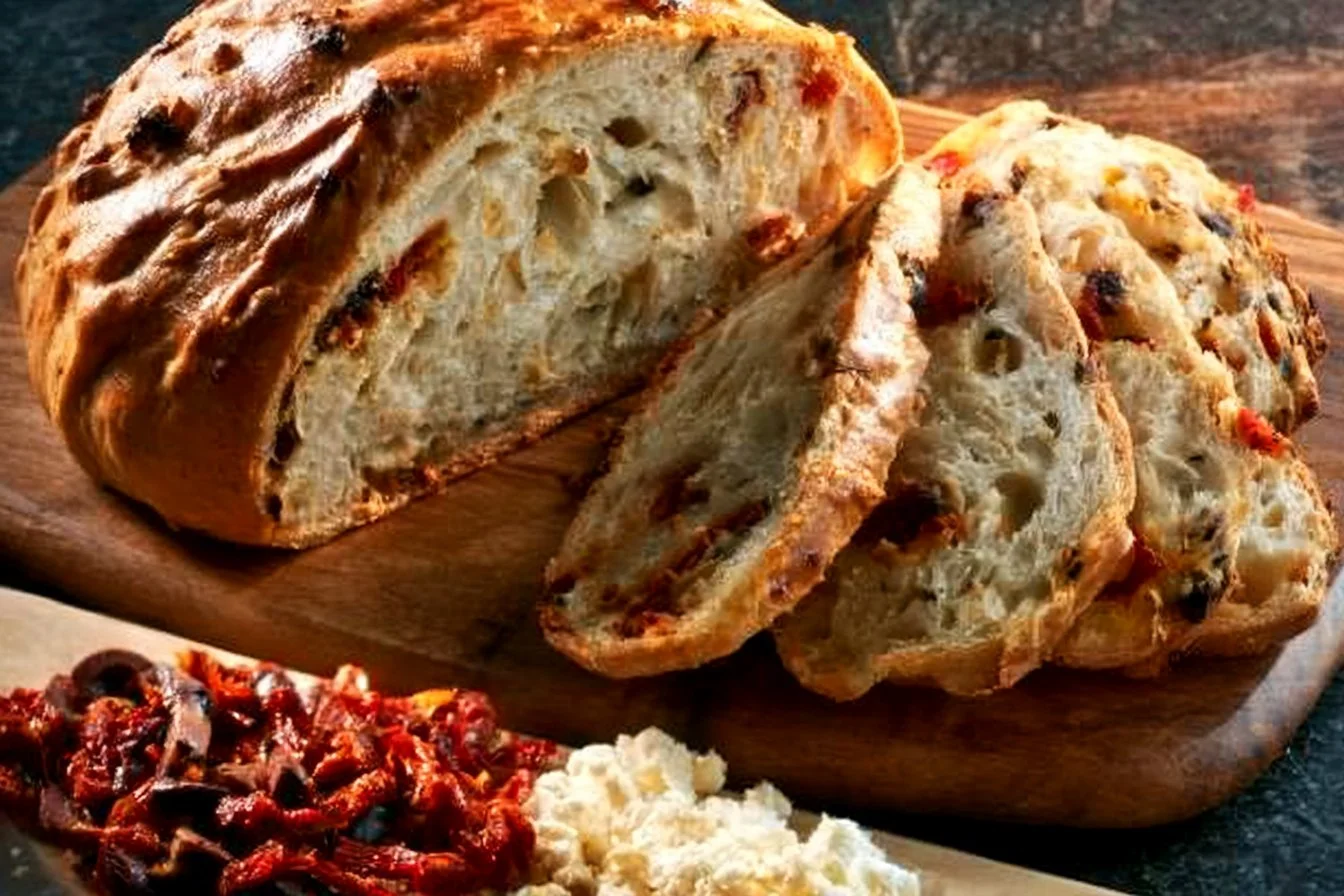 Delicious no knead sun-dried tomato, olive, and feta bread freshly baked.