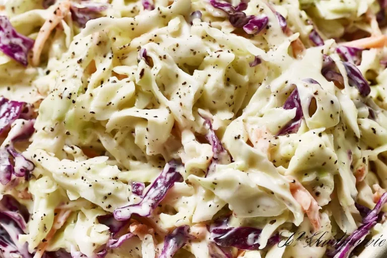 Bowl of perfectly balanced coleslaw with fresh vegetables and dressing